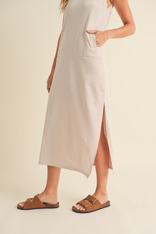 Rosie Midi DressIntroducing our Sleeveless Terry Cloth Midi Dress – a blend of comfort and style for your summer wardrobe.Crafted from soft terry cloth fabric, this midi-length dress keeps you cool and cozy all day. The sleeveless design is perfect for su