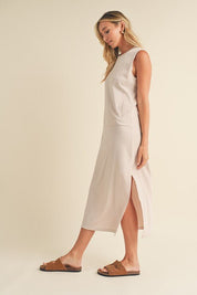 Rosie Midi DressIntroducing our Sleeveless Terry Cloth Midi Dress – a blend of comfort and style for your summer wardrobe.Crafted from soft terry cloth fabric, this midi-length dress keeps you cool and cozy all day. The sleeveless design is perfect for su