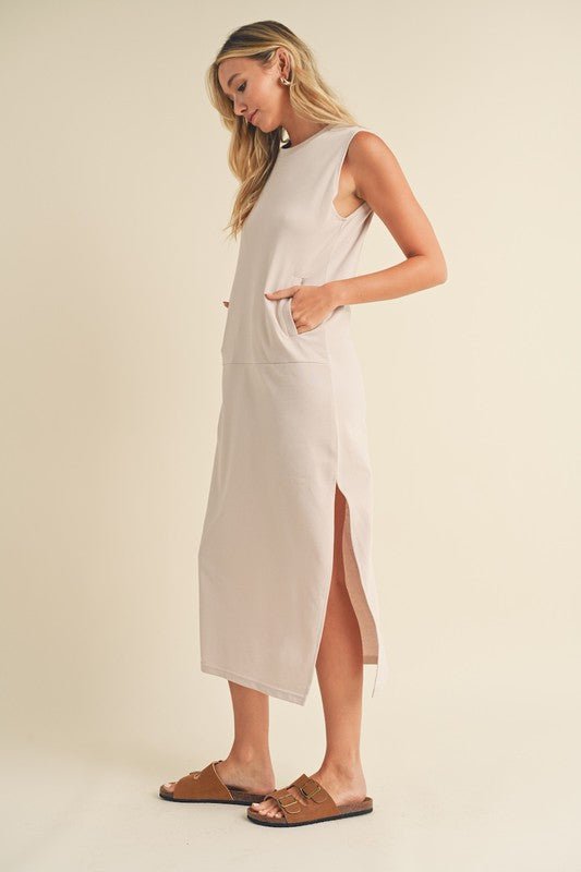 Rosie Midi DressIntroducing our Sleeveless Terry Cloth Midi Dress – a blend of comfort and style for your summer wardrobe.Crafted from soft terry cloth fabric, this midi-length dress keeps you cool and cozy all day. The sleeveless design is perfect for su