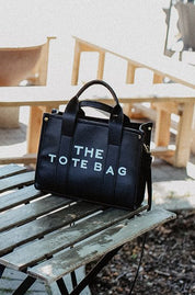 The Tote Bag with Shoulder StrapOnce the item sells out we will be selling a PRE-ORDER - available within 2 weeks Elevate your everyday style with "The Tote Bag with Shoulder Strap," designed to seamlessly blend practicality and chic aesthetics. This slee