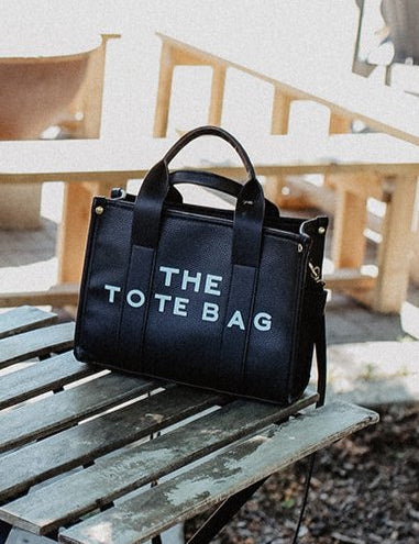 The Tote Bag with Shoulder StrapOnce the item sells out we will be selling a PRE-ORDER - available within 2 weeks Elevate your everyday style with "The Tote Bag with Shoulder Strap," designed to seamlessly blend practicality and chic aesthetics. This slee