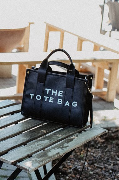 The Tote Bag with Shoulder StrapOnce the item sells out we will be selling a PRE-ORDER - available within 2 weeks Elevate your everyday style with "The Tote Bag with Shoulder Strap," designed to seamlessly blend practicality and chic aesthetics. This slee