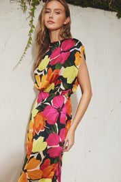 Tropical Burst DressIntroducing our enchanting Floral Satin Dress, a captivating blend of elegance and versatility. Crafted to elevate your style for any occasion, this dress embodies timeless grace with modern flair. Adorned with a high neckline and deli