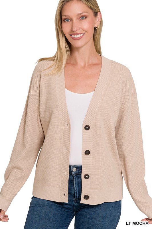 Vera CardiganThis lightweight knit cardigan is the perfect spring sweater! With a drop shoulder and a loose fit through the arm, this piece can easily be dressed up or down! Perfect for a day at the office or a cool spring evening. SIZE & FIT Fit: This ga