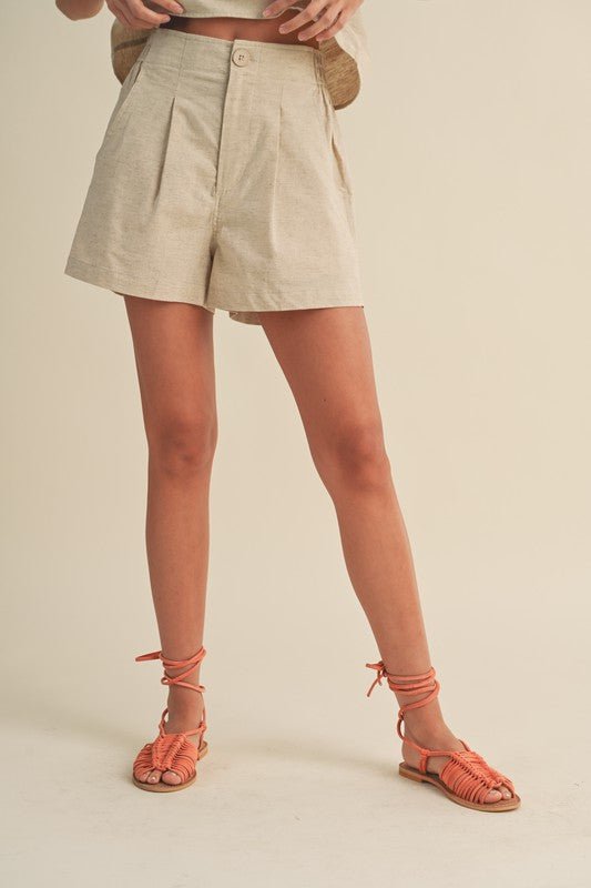 Zinnia ShortThe Zinnia Shorts are guaranteed to be a warm weather staple! With a high rise waist with an elasticated back, and a flowy fit through the leg, these 100% cotton shorts, are lightweight, breathable, and the perfect blend of dressy and casual.