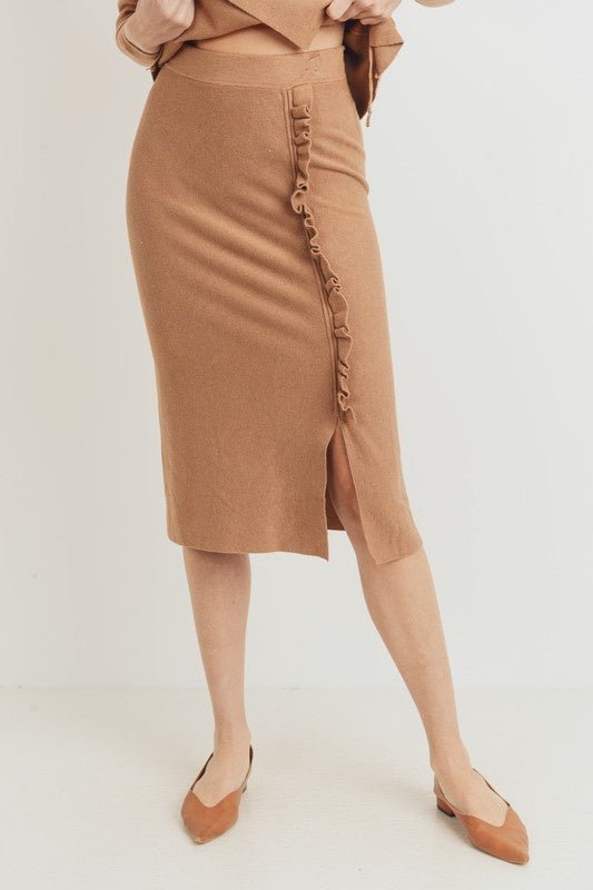 Elle Ruffle Midi Skirt - FINAL SALEThe Elle Ruffle Midi Skirt is a great edition to your workwear wardrobe! Made of a comfy stretch fabric with a high rise waist and a no-worries midi length! Complete with a front ruffle detail and slit. SIZE & FIT Fit: T