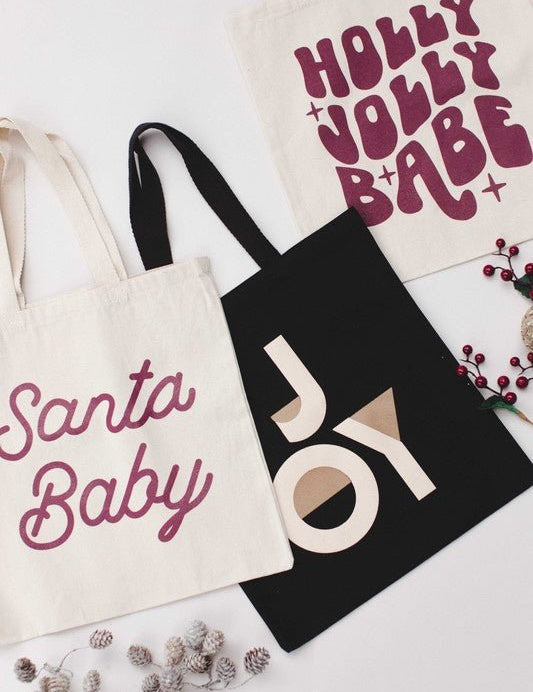 Holiday Bags - Santa Babyhigh quality 12 oz cotton canvas Width 15 inch Height 16 inch Handle 21 inchHoliday Bags - Santa Baby}Style BarSpace 46Style Bar