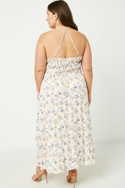 Iris Halter Neck Maxi Dress - FINAL SALEDESCRIPTION: Dainty floral print maxi dress with smocked bodice and adjustable straps Made In: Imported Content: 100% Rayon Washing Instructions: Hand Wash Cold / Hang to Dry Fit: TTS. Model is wearing size 1XIris H