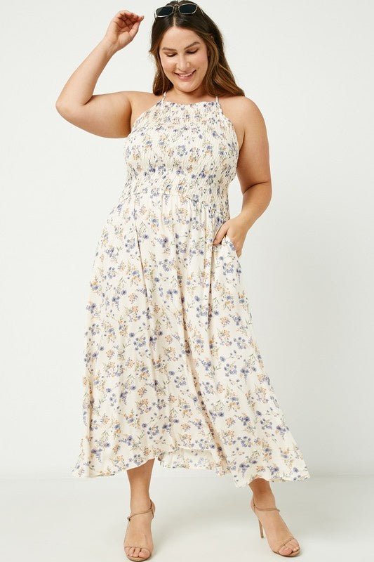 Iris Halter Neck Maxi Dress - FINAL SALEDESCRIPTION: Dainty floral print maxi dress with smocked bodice and adjustable straps Made In: Imported Content: 100% Rayon Washing Instructions: Hand Wash Cold / Hang to Dry Fit: TTS. Model is wearing size 1XIris H