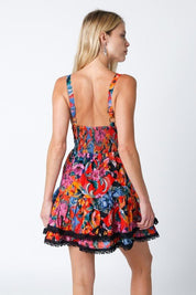 Kylin Mini Dress - FINAL SALEThe Kylin Mini Dress features a double lined woven fabric in a deep, rich floral print. Features a bustier style top with dainty lace detials, adjustable straps, a smocked back, and a beautiful layered skirt. SIZE & FIT Fit: T