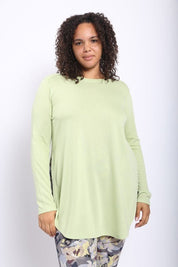 Lisa Basic Curve Long Sleeve Top - FINAL SALEDESCRIPTION: This no-frills long-sleeve top features curved bottom hems and slit on each side that goes all the way up to the hips. Wed recommend pairing it with leggings or denim pants for an eclectic look. Ma