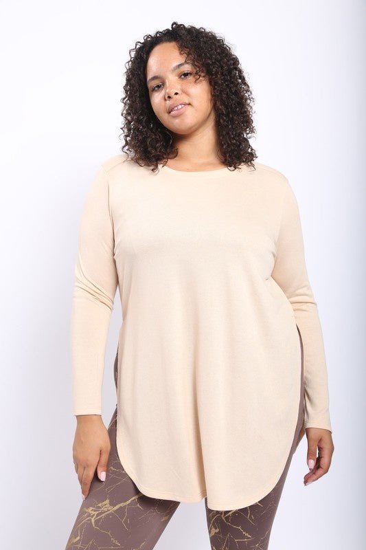 Lisa Basic Curve Long Sleeve Top - FINAL SALEDESCRIPTION: This no-frills long-sleeve top features curved bottom hems and slit on each side that goes all the way up to the hips. Wed recommend pairing it with leggings or denim pants for an eclectic look. Ma