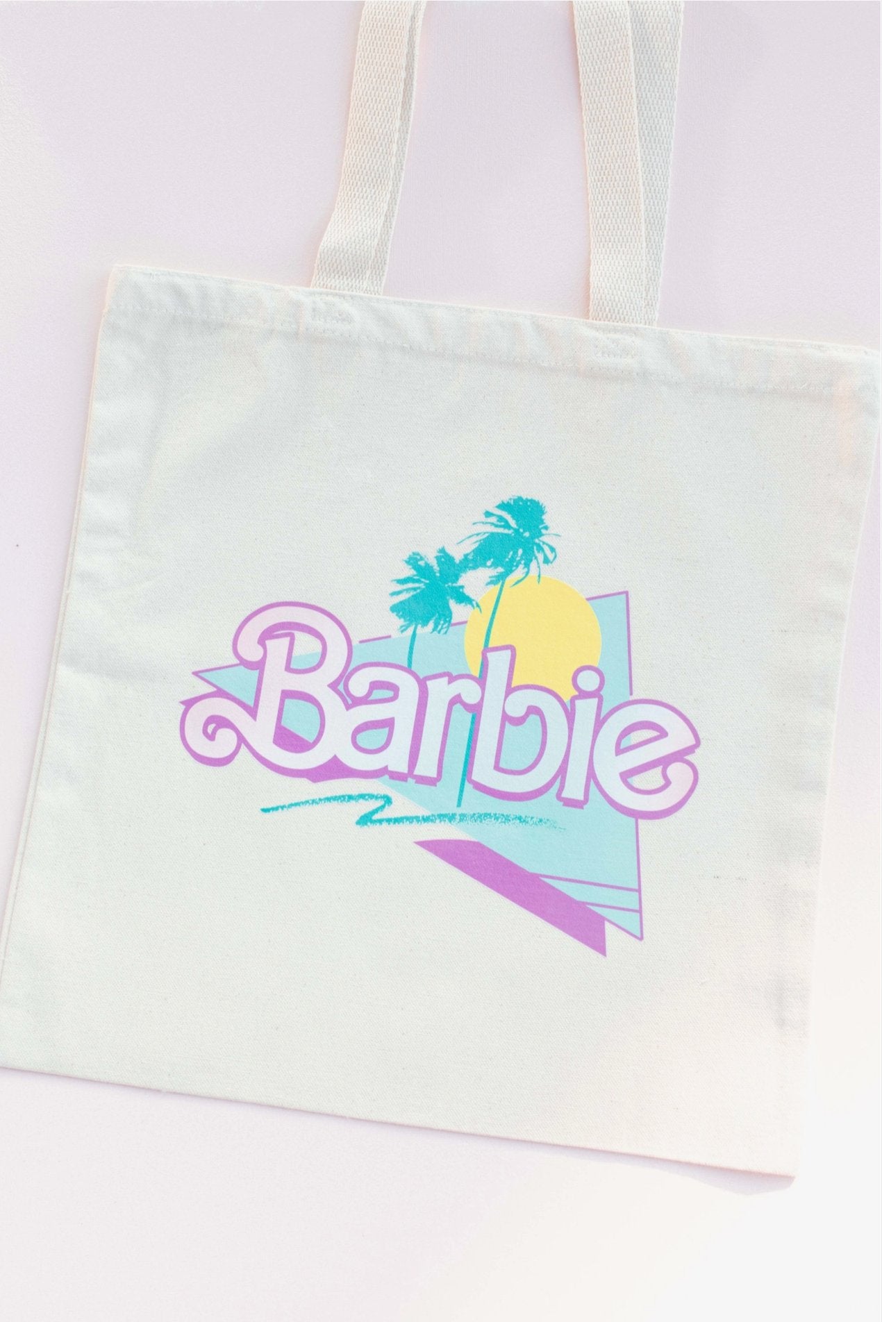 Malibu Barbie Canvas ToteCome on Barbie, lets go party! The perfect summer tote bag, made of high quality, organic cotton canvas. Bag measures 15" x 16", handle 21"Malibu Barbie Canvas Tote}Style BarSpace 46Style Bar