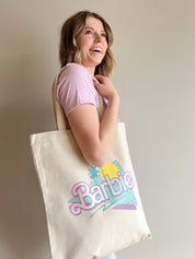 Malibu Barbie Canvas ToteCome on Barbie, lets go party! The perfect summer tote bag, made of high quality, organic cotton canvas. Bag measures 15" x 16", handle 21"Malibu Barbie Canvas Tote}Style BarSpace 46Style Bar