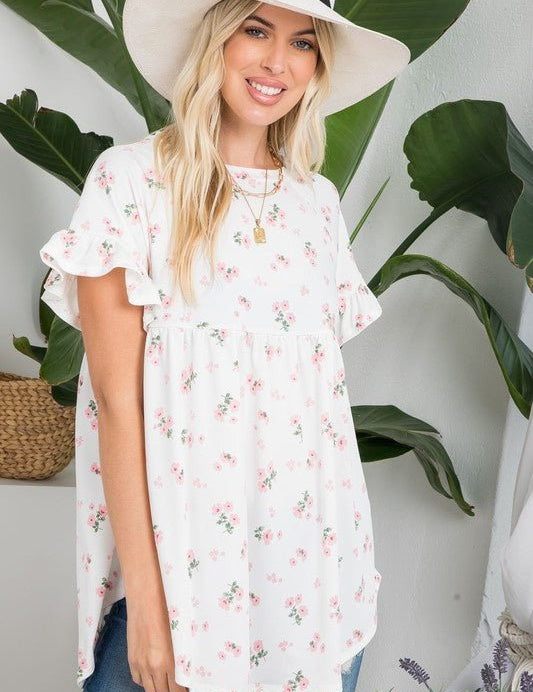 Peony Babydoll TopPRODUCT DESCRIPTION: The Peony Babydoll Top is a comfortable and versatile piece thats easy to wear and grows with you! Featuring a dainty floral print with a round neckline and short sleeves in a classic babydoll silhouette. SIZE & FIT