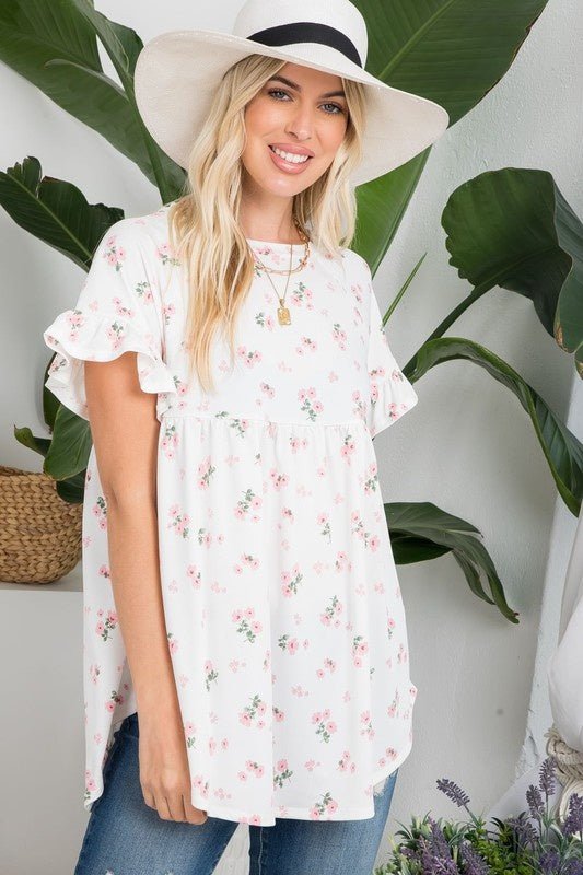 Peony Babydoll TopPRODUCT DESCRIPTION: The Peony Babydoll Top is a comfortable and versatile piece thats easy to wear and grows with you! Featuring a dainty floral print with a round neckline and short sleeves in a classic babydoll silhouette. SIZE & FIT