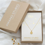 Tiny Zodiac Medallion NecklaceAdorable 1 cm diameter vintage zodiac medallions on 16" + 2" barley chain. 4k gold over brass. Carded on 100% recycled paper, letter pressed gold foil. Designed and assembled in Sonoma California. 100% made in the USA.Tiny Zo